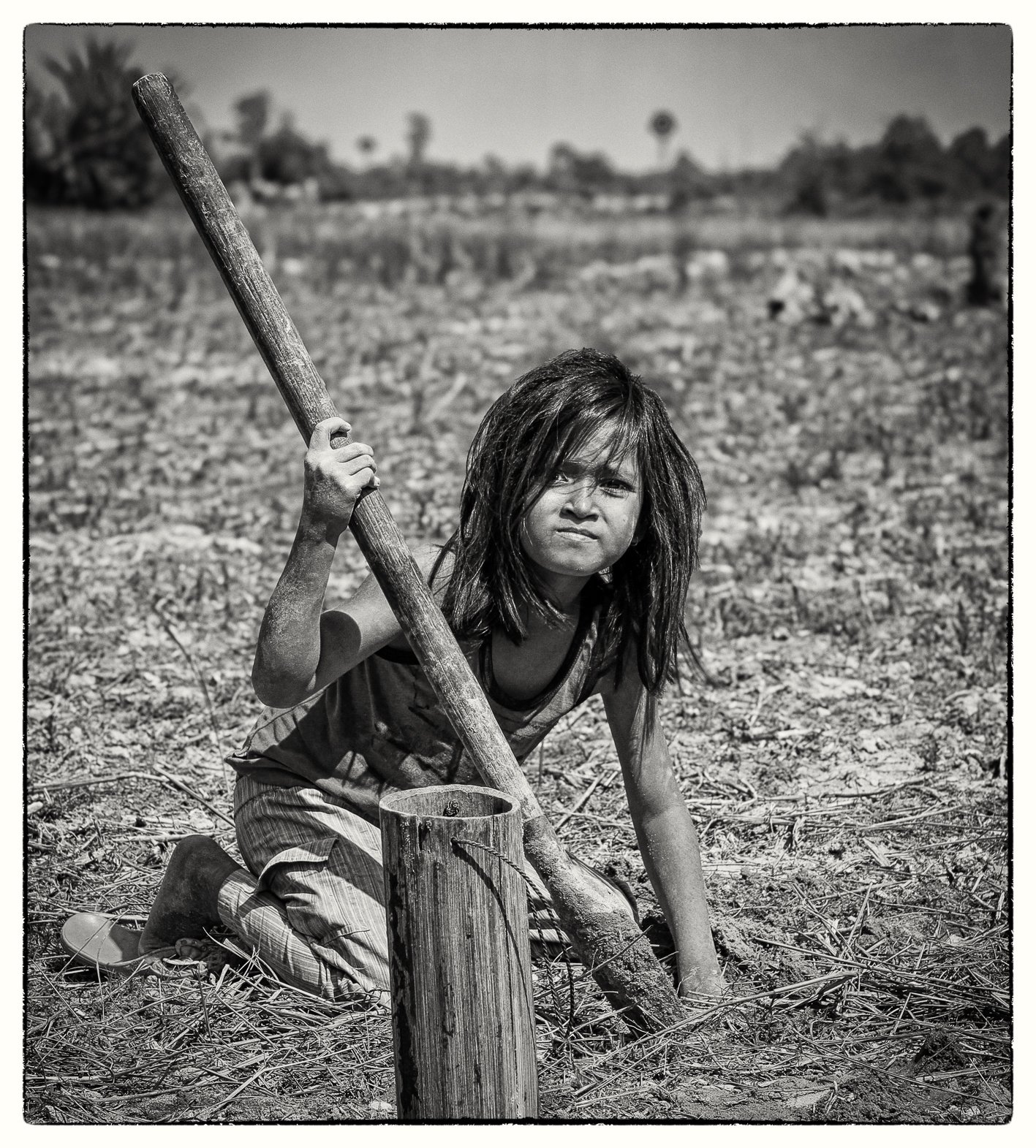 Girl digging for sweet water crabs.